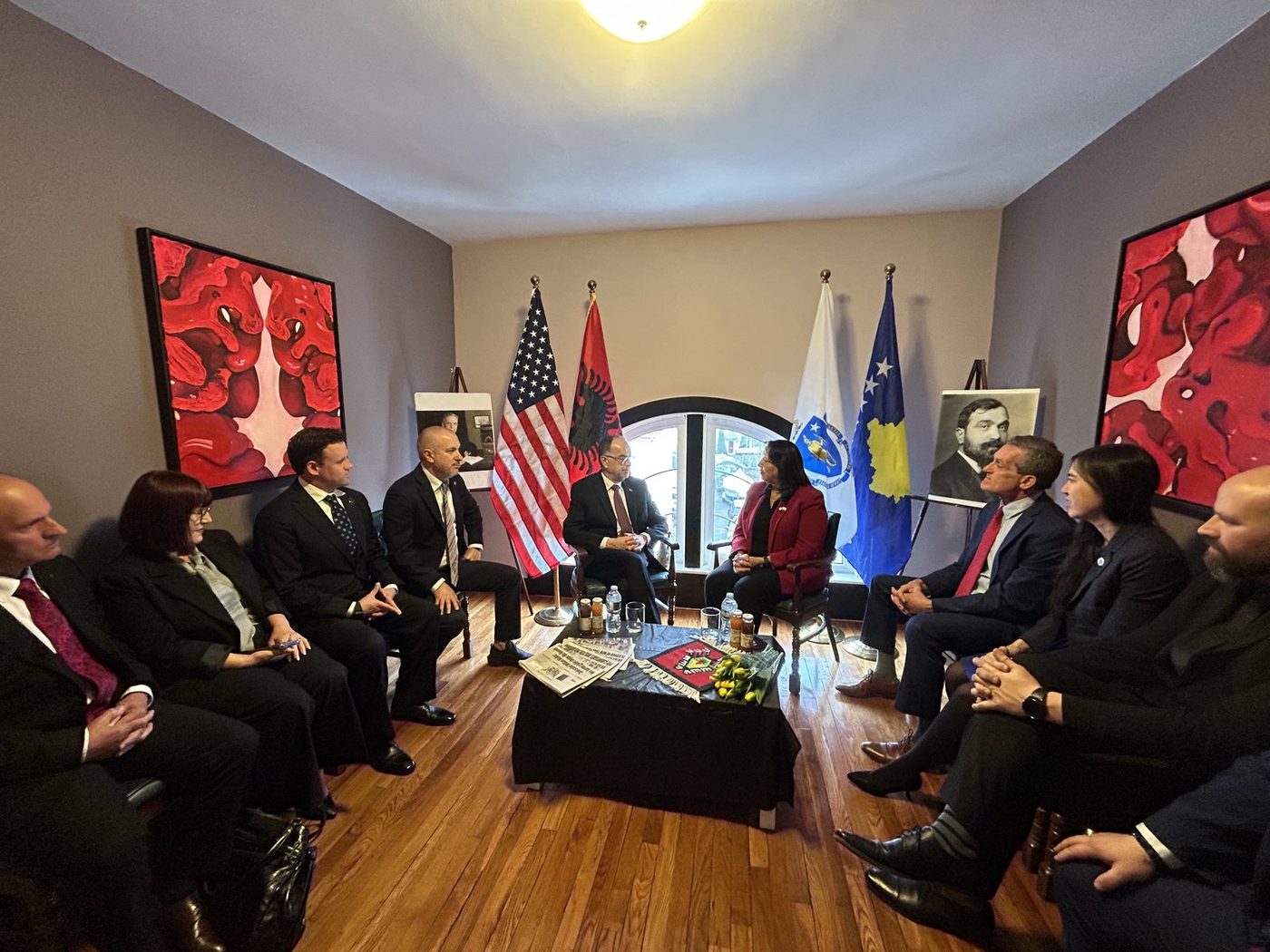 Track two meeting room with the flags of the United States, Albania, and Kosovo